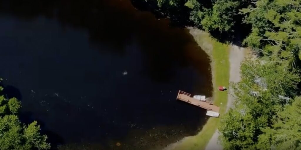 overhead shot of a pond at a camping ground